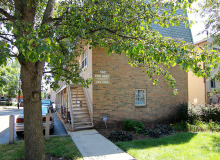 brick apartment building with parking