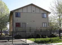 tan apartment building with porch