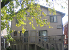 tan apartment building with a deck