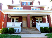 red brick duplex with porch
