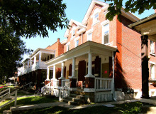 red brick duplex with porch